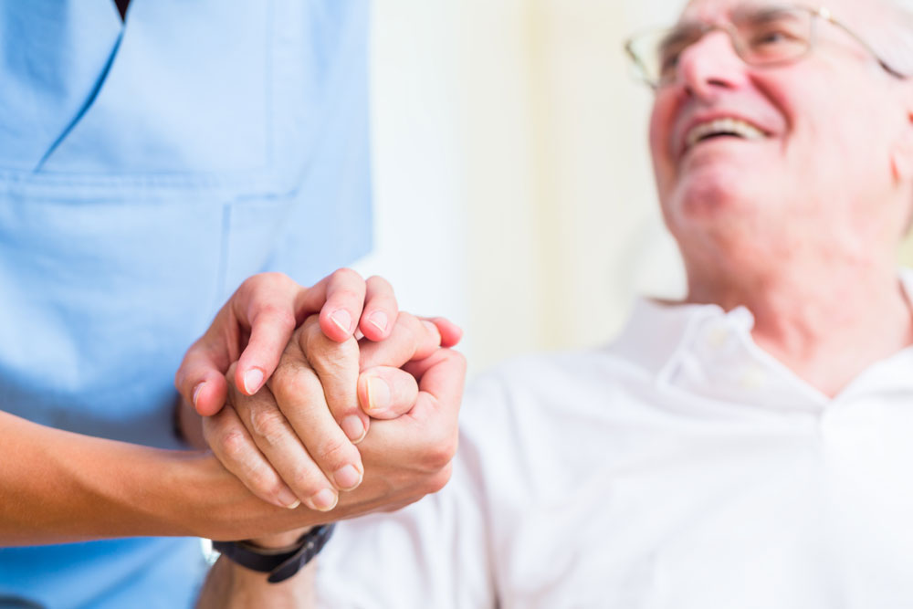 Caregiver Holding Hand